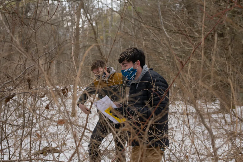 Students identify invasive plants in the Emmons Preserve