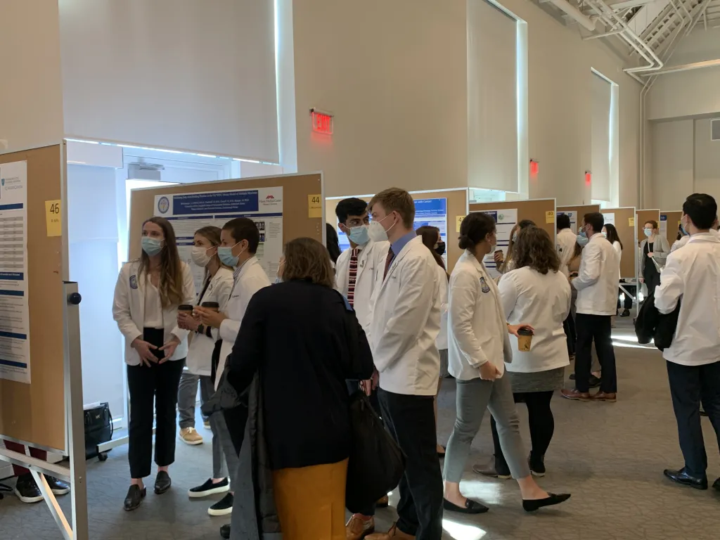 Students and spectators watch presentations