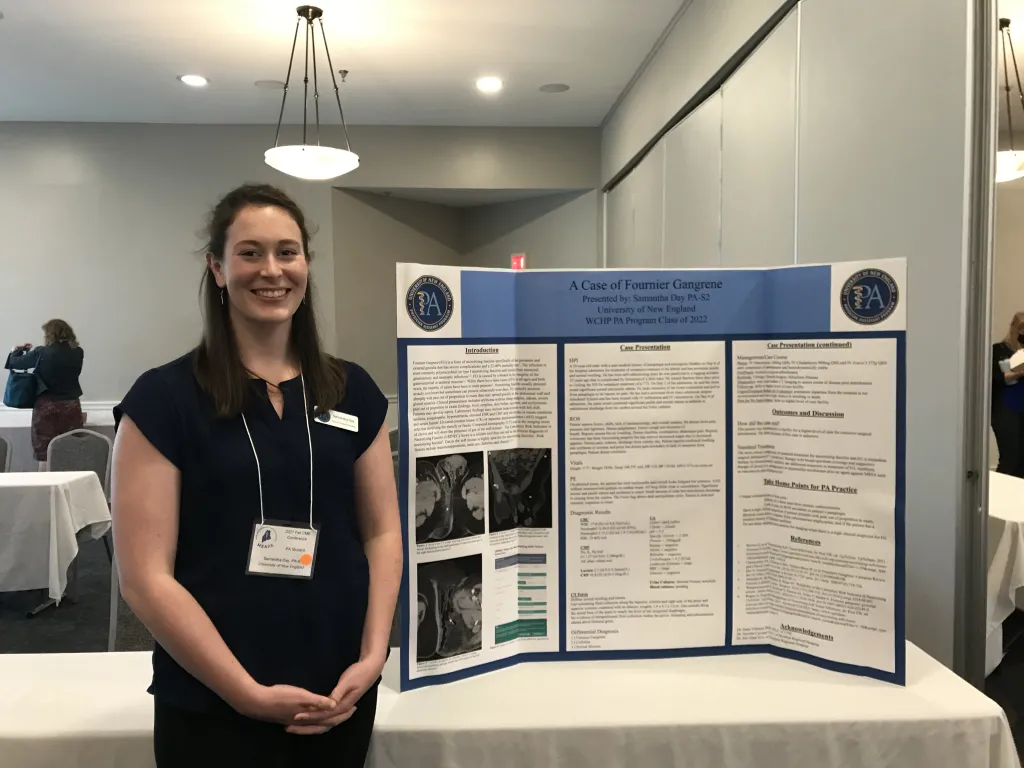 Samantha Day stands next to her poster