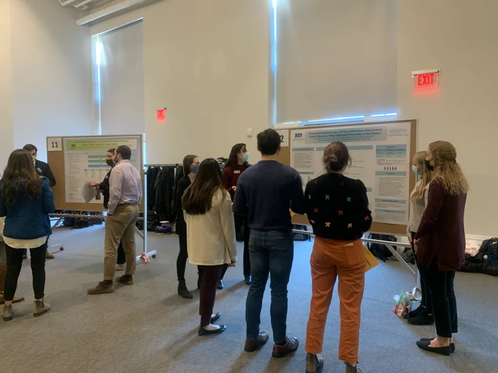 Spectators gather to hear student presentations