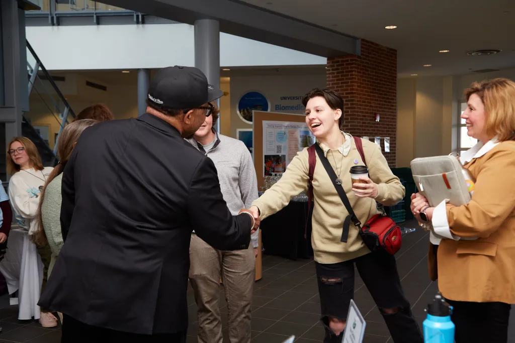Rev. Lennox Yearwood greets students
