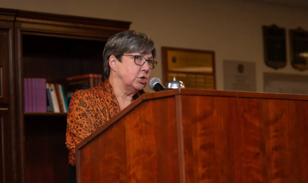 Professor Elizabeth DeWolfe speaks at the podium