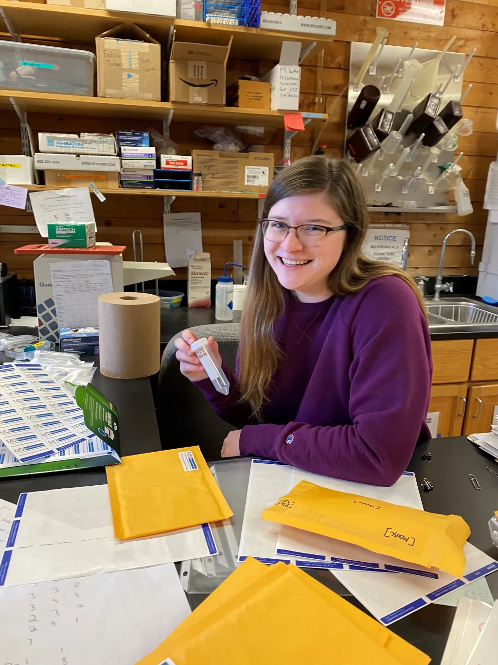 UNE student Brooke Parks holds a water quality sample