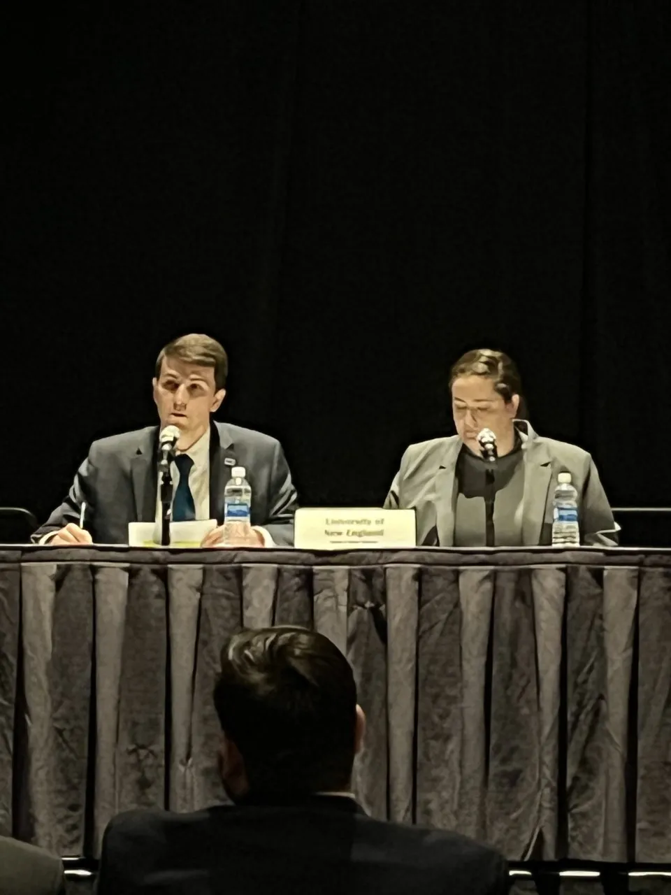 Josua Golden and Leanne McDowell participate in the debate