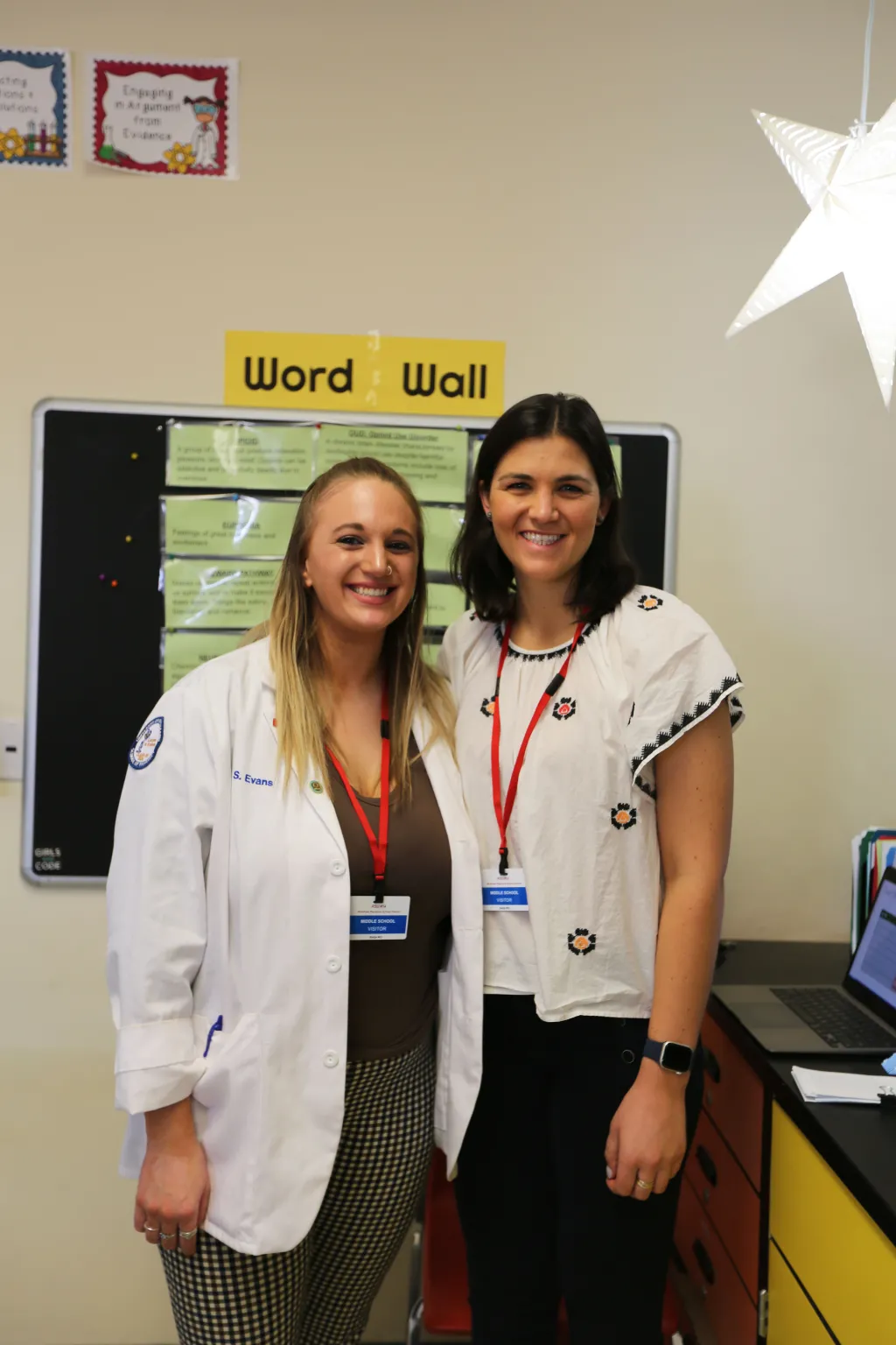 Pharmacy and COM student together after the presentation
