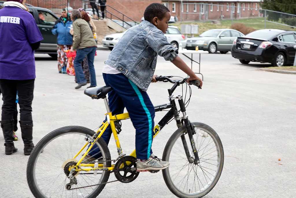 A kid riding a bicycle