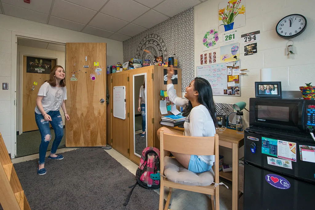 Two U N E students in a dorm room