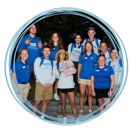 A group of U N E students stand together at a First Night event