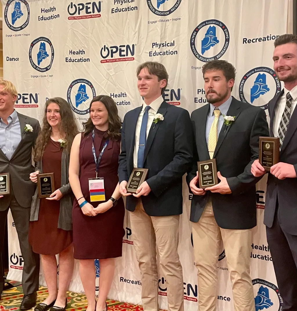 Tyler Calhoun poses with his award and other recipients