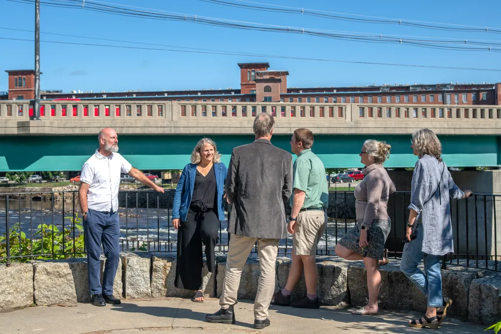 Brad Favreau, Michele Polacsek, Cameron Wake and Delilah Poupore have a conversation in downtown Biddeford.