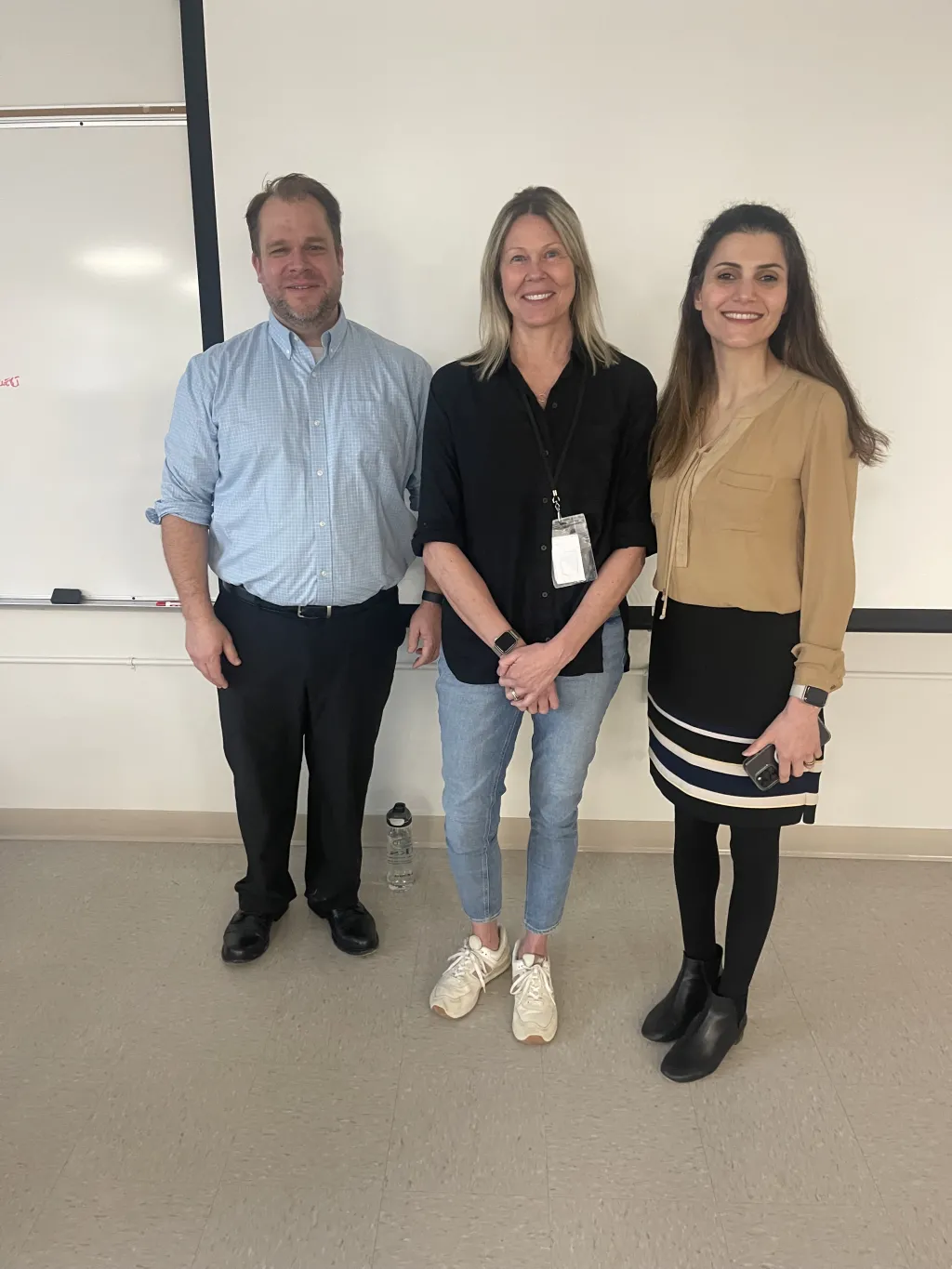 UNE's Tim Potsaid and Golshan Madraki pose with Biddeford Schools instructor Karen Gellis