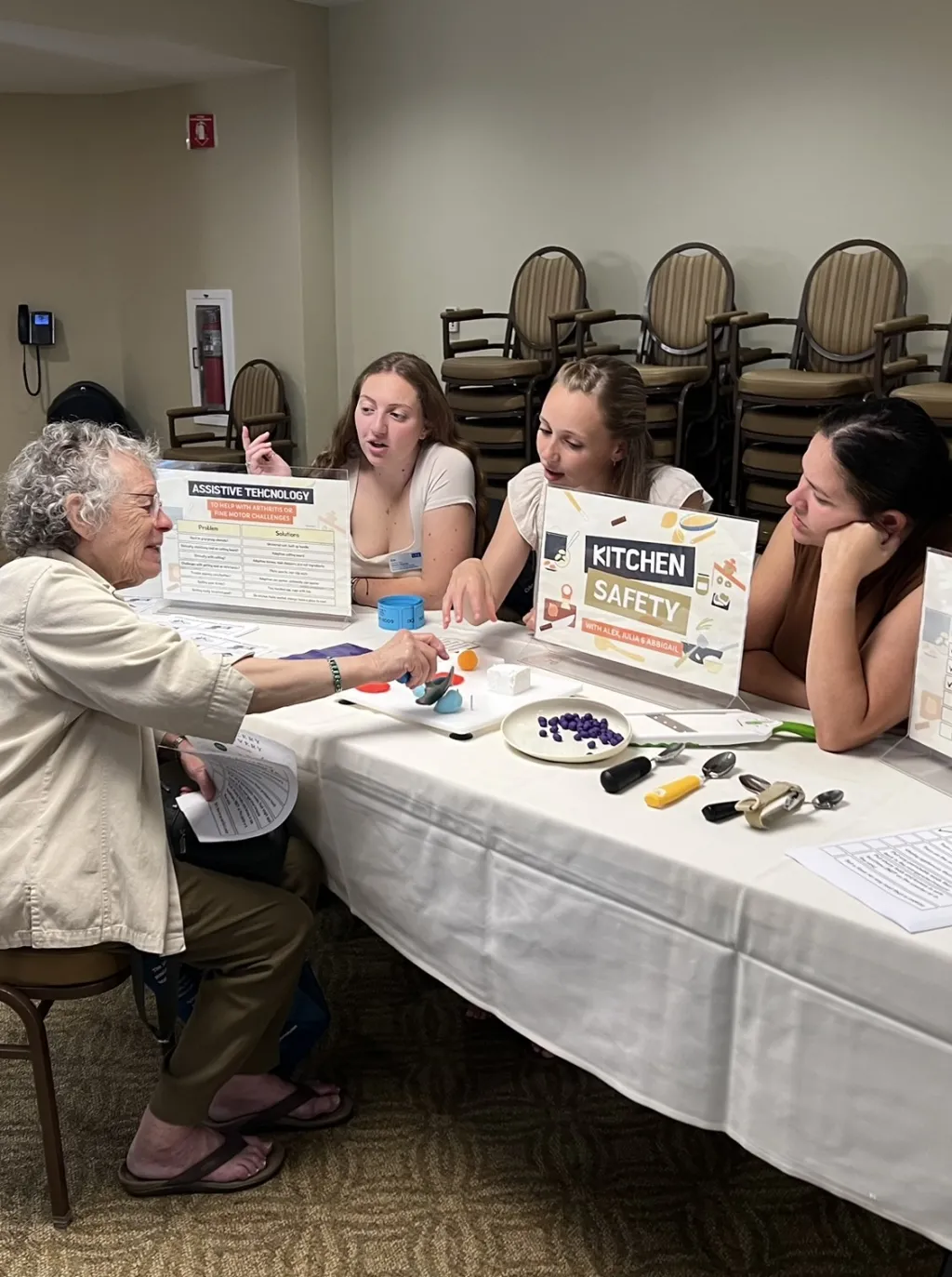 UNE students discuss kitchen safety with a resident of The Park Danforth