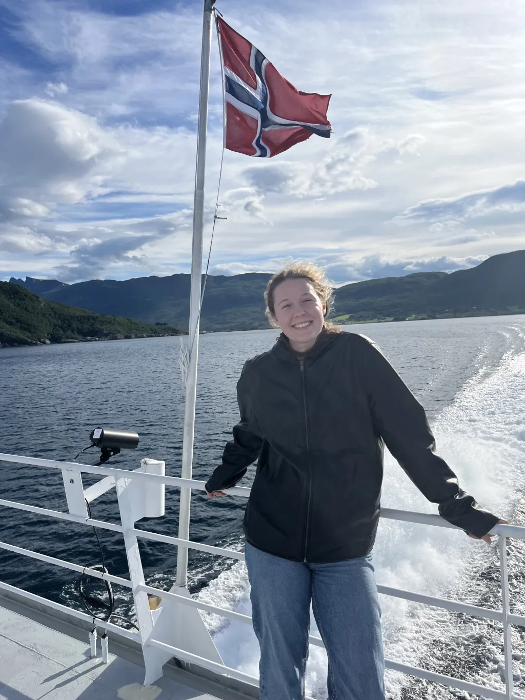 UNE student Lydia Jones poses in front on a Norwegian research boat