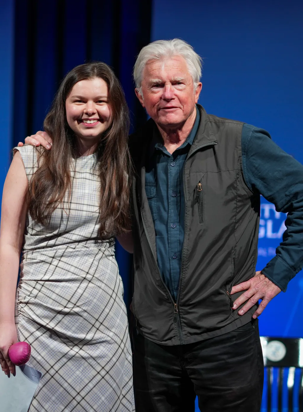 A UNE student poses with philanthropist David Shaw