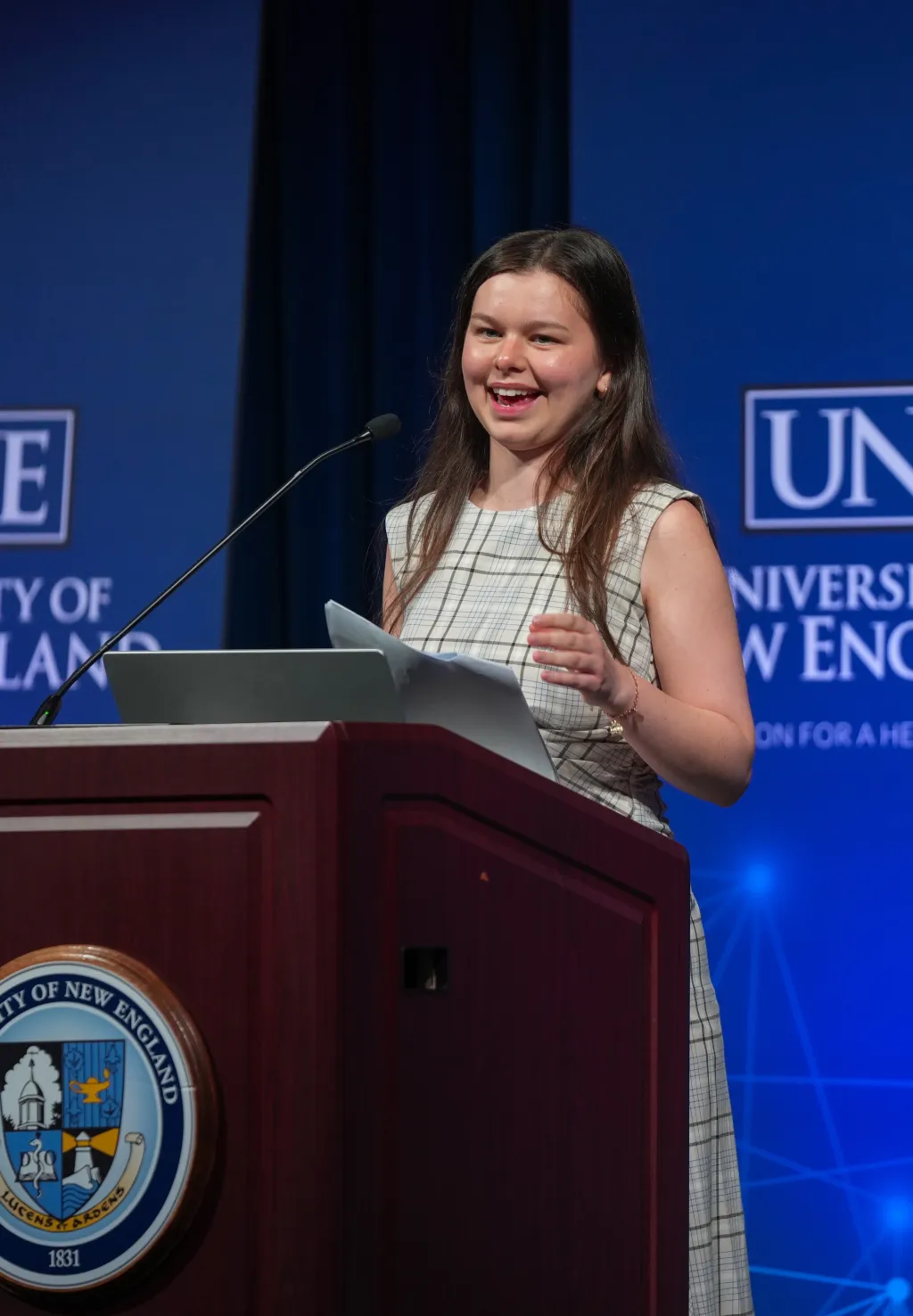 A student speaks at a podium
