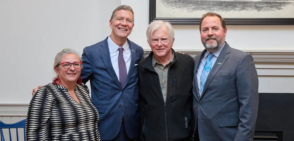 UNE senior leadership pose with David Evans Shaw