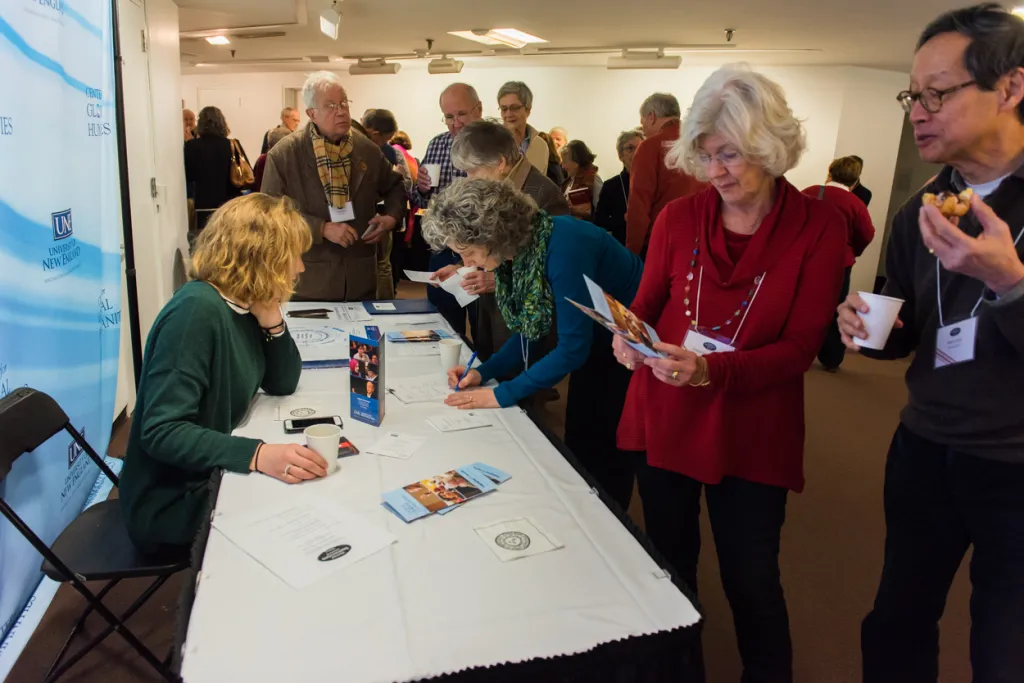 Rebecca Barr, UNE Global Education coordinator, talks with attendees