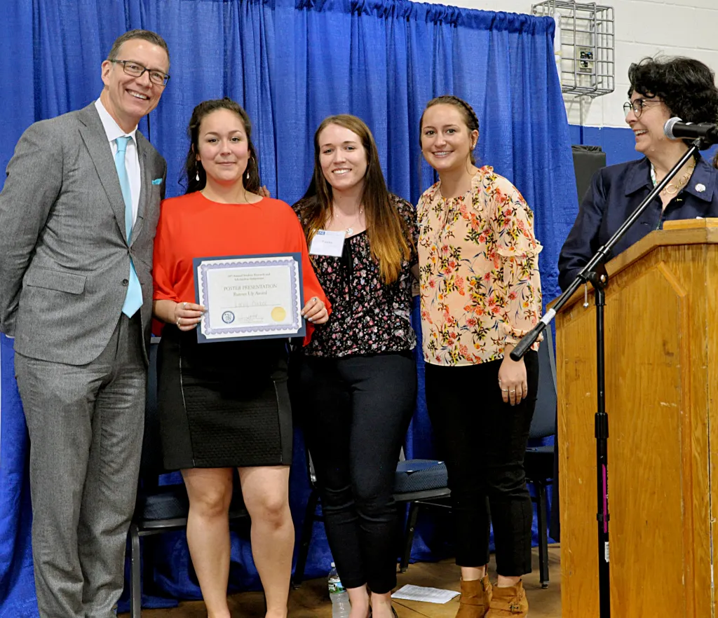 President Herbert and Dean Hey congratulate student winners