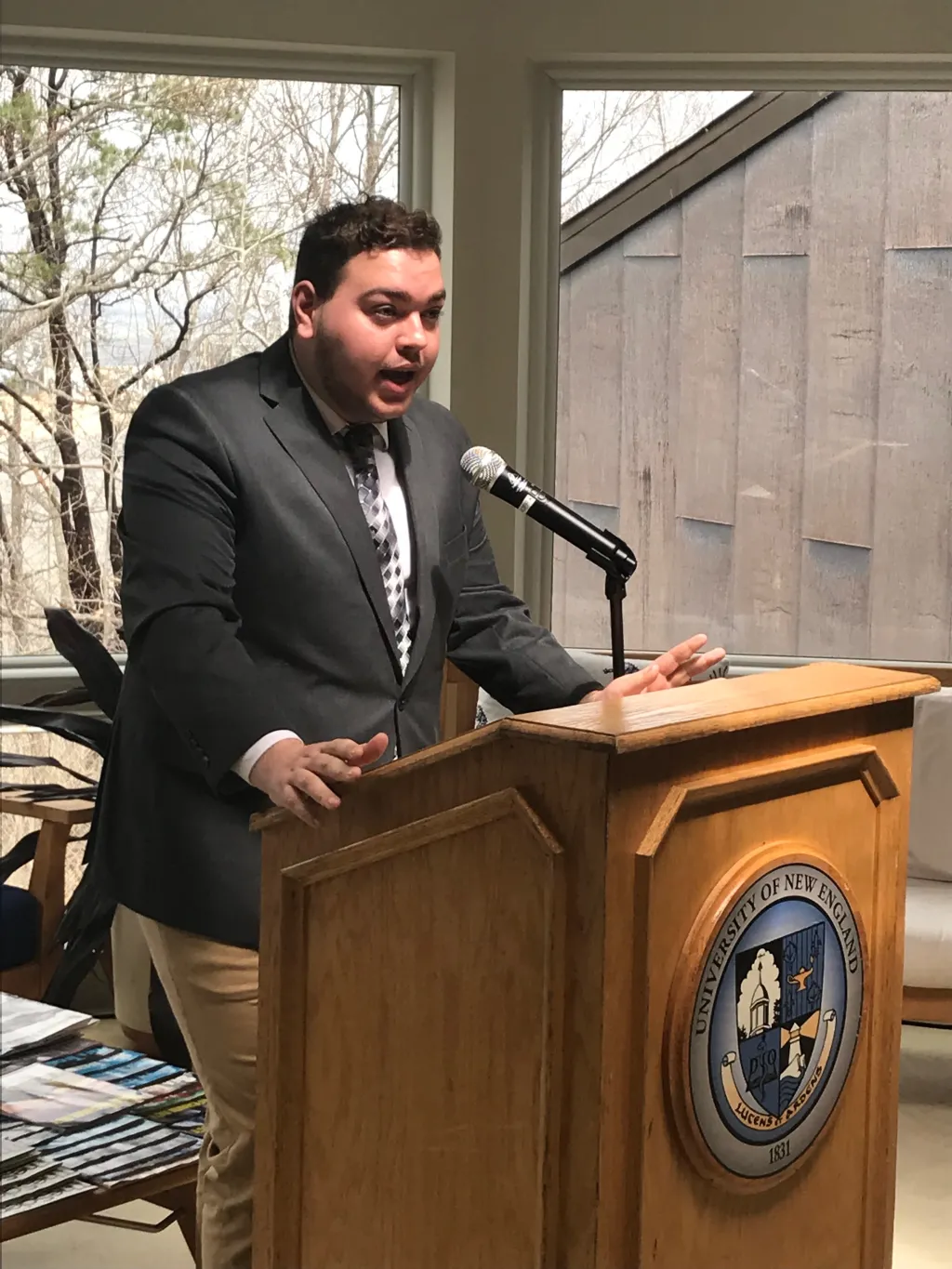 Griffin Kmon, president of the Undergraduate Student Government, speaks at an event celebrating the new solar array