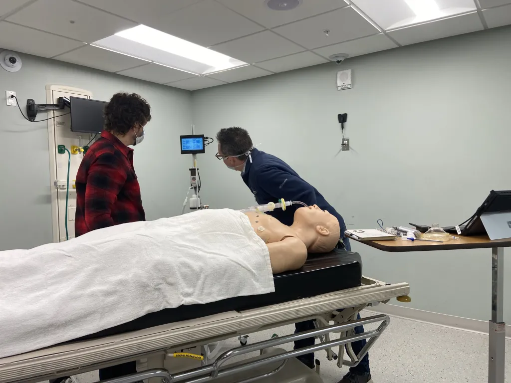 Amory and Gemmel check the results of the ventilator test