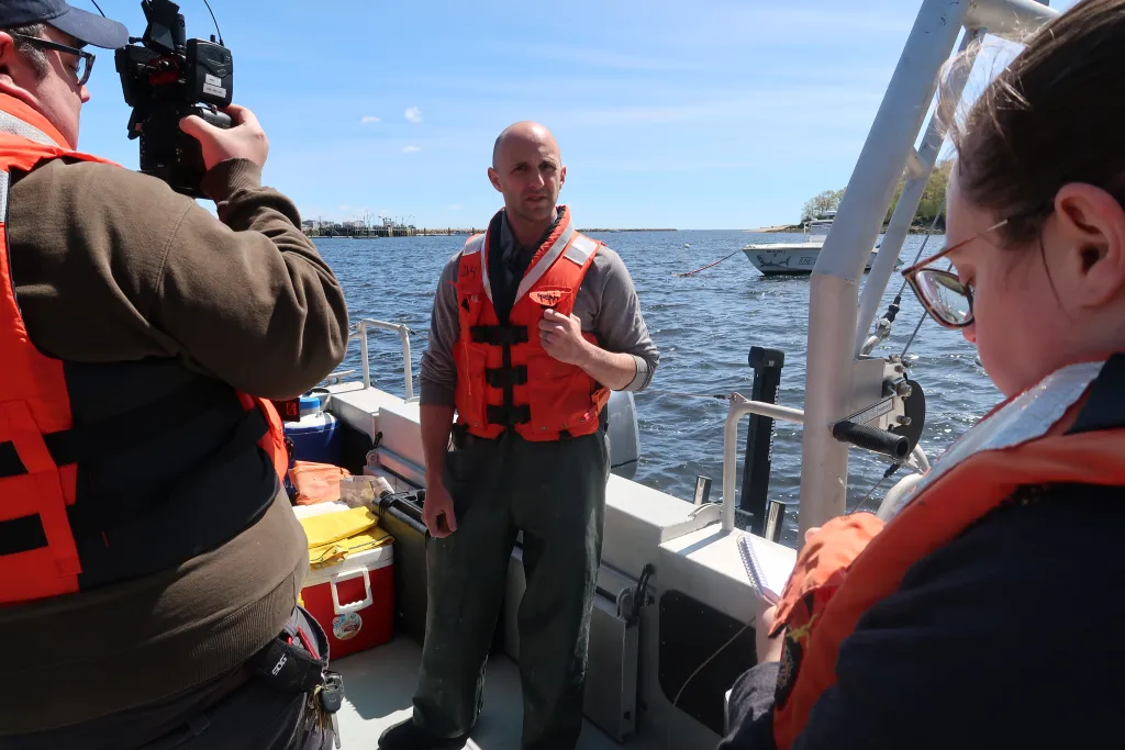 Adam St. Gelais being interviewed by WCSH and Gillian Graham of the Portland Press Herald