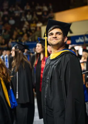 A student candid from UNE's 2026 Commencement