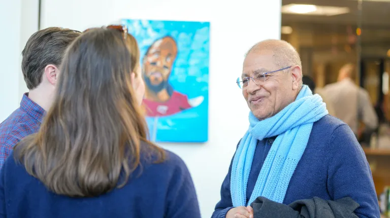 Author Ali Ahmeda chatting with other authors at the event
