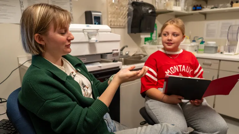 Assistant Professor Tricia Thibodeau and third-year marine science major Piper Stagg took time to lead a private tour of the Arthur P. Girard Marine Science Center for a 10-year-old aspiring researcher, carrying on a legacy of discovery throughout the next generation of scientists.