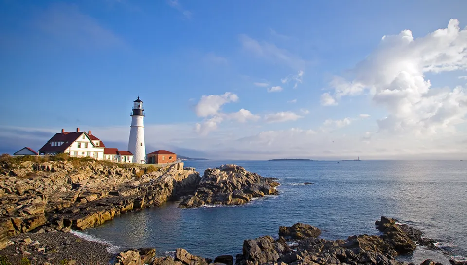 The Portland Head Light on the rocky coast of Maine overlooking the ocean