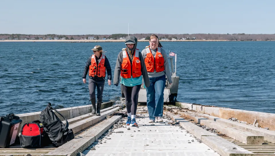 UNE team of students and faculty install seismometer on Ram Island