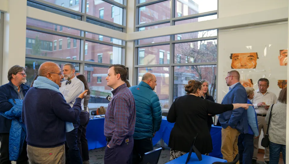 A crowd milling around the Art Gallery in Ketchum Library on Biddeford Campus