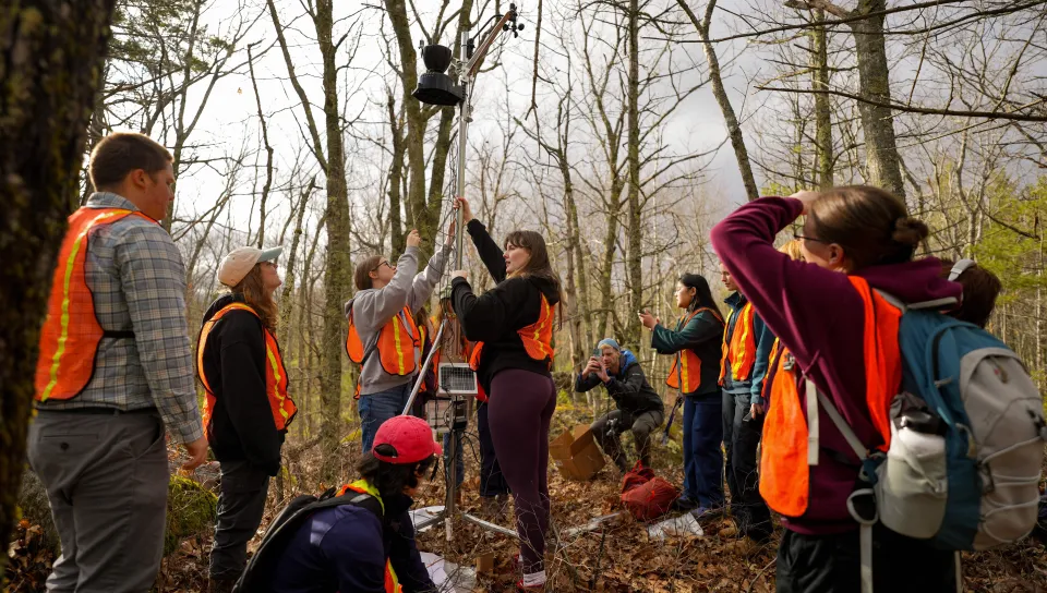 UNE students install a weather station in UNE's research forest