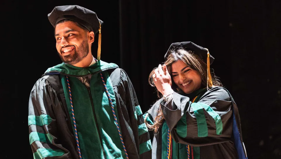 Hammad and Hafsa Sadiq smile onstage