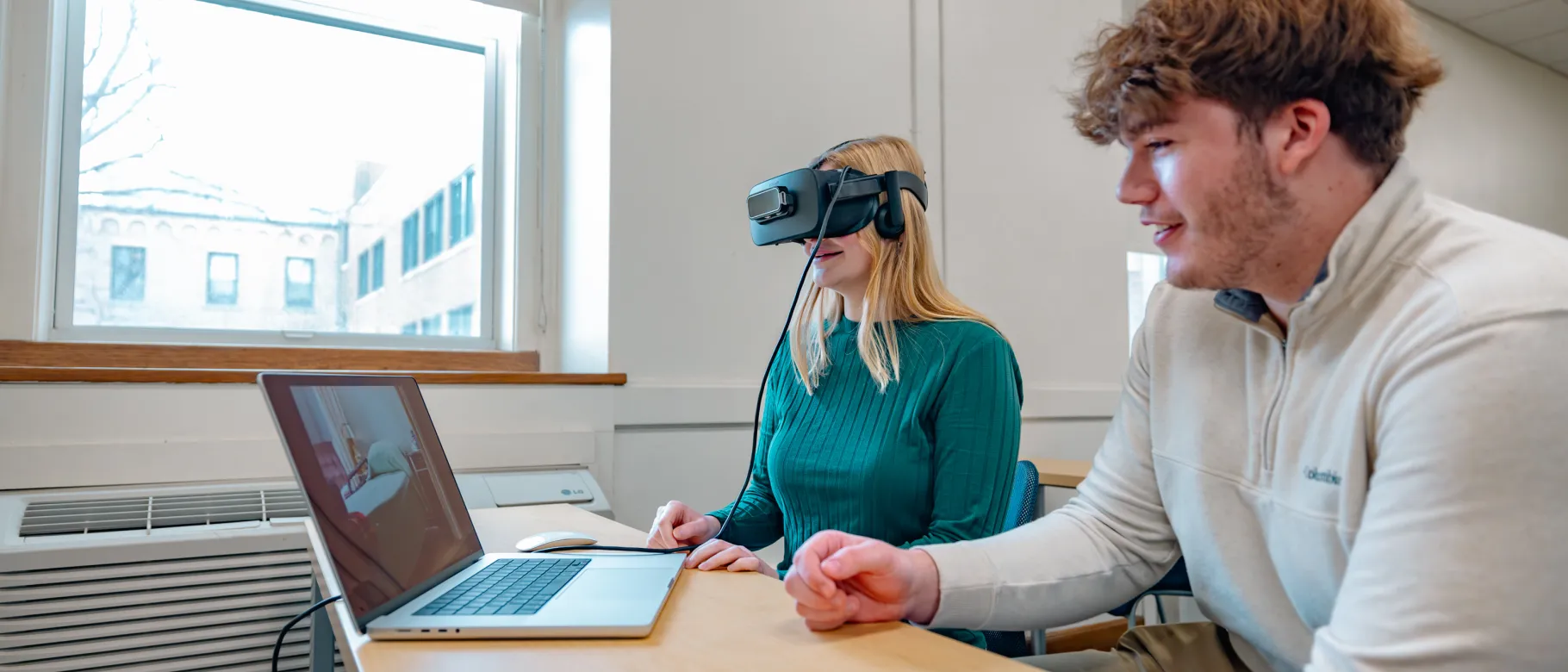 Students use a VR headset for a classroom activity
