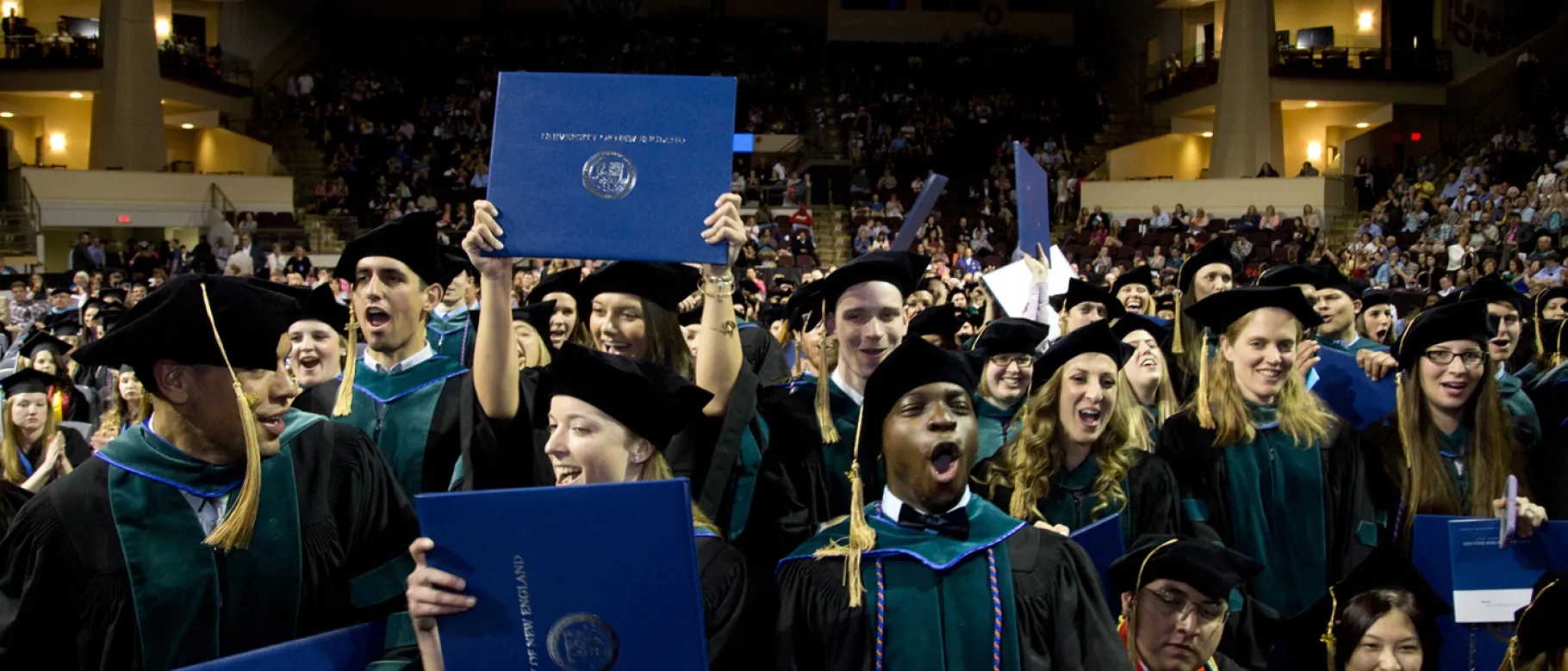 Throngs of happy graduates celebrate the moment.