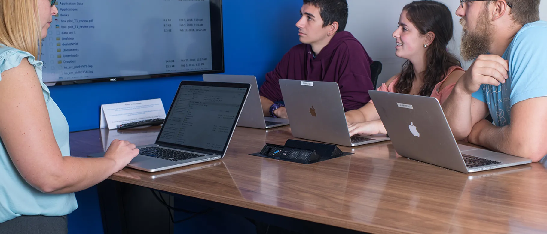 UNE students sit in a data science class