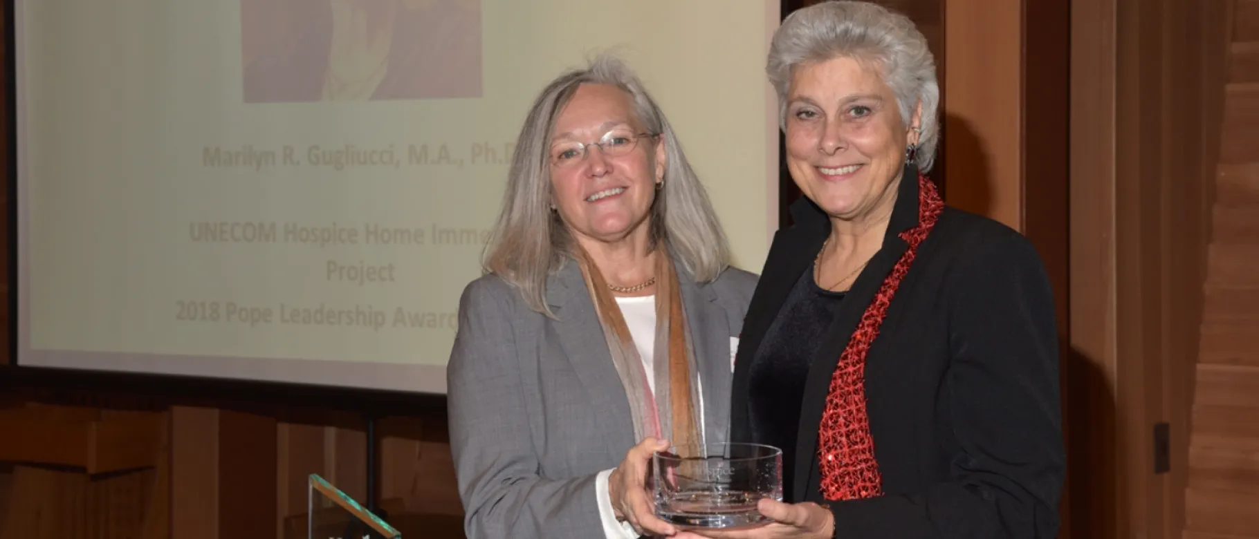 Marilyn Gugliucci accepts the Katherine Pope Leadership Award from Hospice of Southern Maine