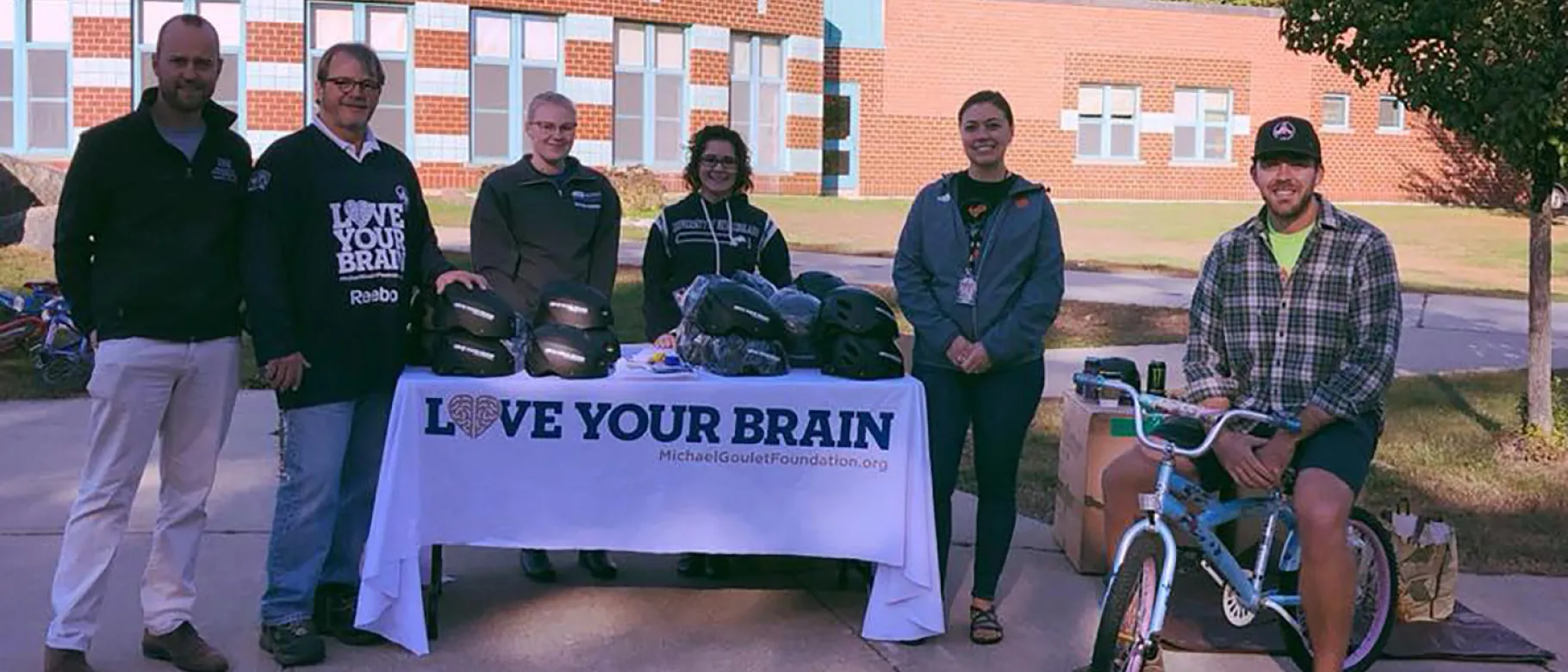 UNE students and faculty worked with volunteers from the Michael T. Goulet foundation to fit and distribute over 350 helmets