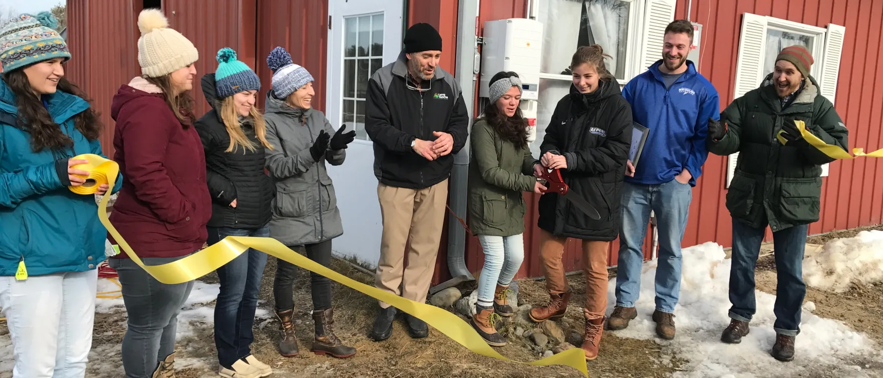 UNE’s solar ambassadors celebrate the ribbon cutting with representatives from Revision Energy, Camp Ketcha and RE-volv. L-R: Le
