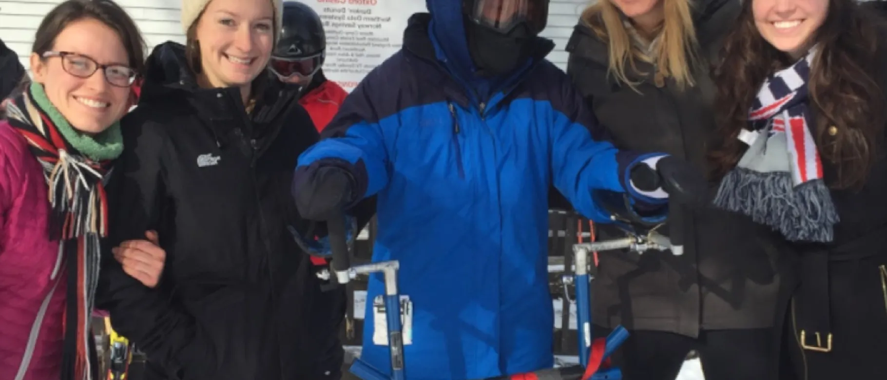 UNE physical therapy students work with a participant in Maine Adaptive Sports and Recreation's Ski-A-Thon.