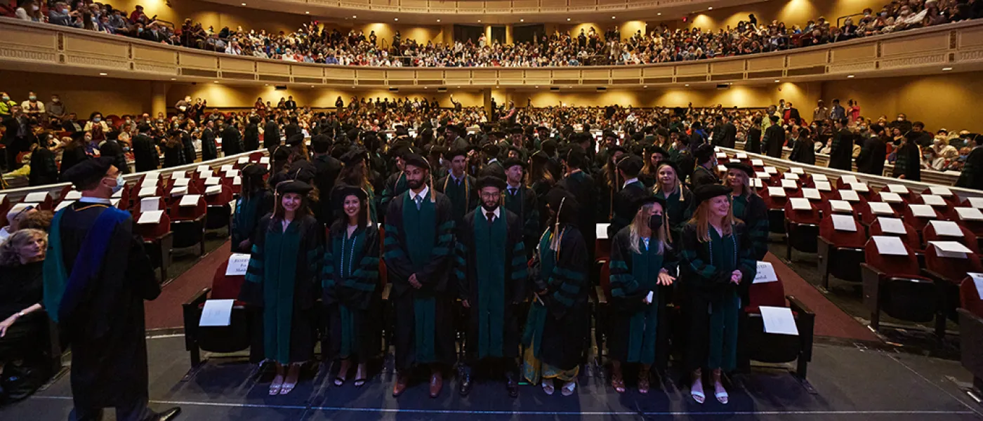 UNE COM students line up for graduation at Merrill Auditorium in Portland