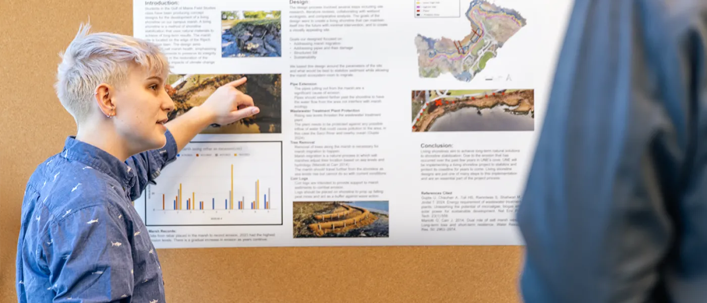 A student presents their research on climate change affecting the coast of Maine to a group