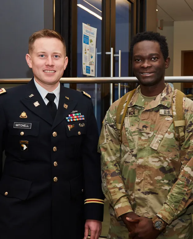 Two veterans stand side-by-side