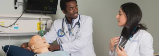 two osteopathic medicine students in the simulation lab