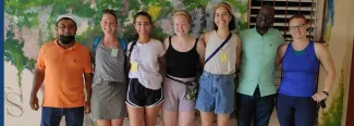 UNE student Celia Larson poses with a group of peers at the Hillside Health Center