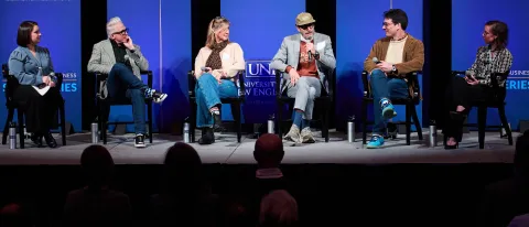 A panel of speakers onstage