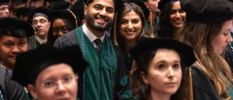 Hammad and Hafsa Sadiq smile at graduation