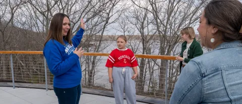 UNE professor and student show a curious middle-schooler the ropes of marine research