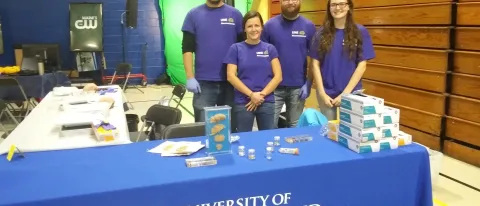 Michael D'Apice, Rachel Russell, Neal Mecum and Katy Lowe get ready for the Portland STEM Expo