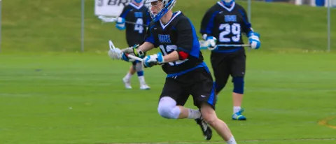 Members of the UNE men's lacrosse team